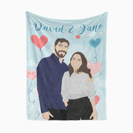 A unique gift, this Ecomartists Personalized Couples Name Blanket features custom hand-drawn illustrations of the couple, "David & Jane," surrounded by heart-shaped balloons.