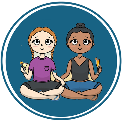 Two girls sitting in lotus position holding toothbrushes.