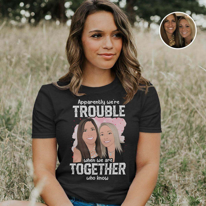 Woman wearing a Ecomartists Personalized Friends Shirt with a custom drawing that reads "apparently we're trouble when we are together who knew," featuring two cartoon women figures.