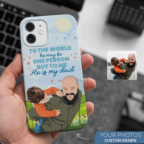 Personalized To The World Dad Phone Case from Ecomartists, depicting a father and child embracing, with the text "to the world he may be one person but to me he is my dad," perfect for Father's Day.