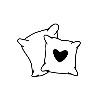 Two pillows in a circle with a heart in the middle.